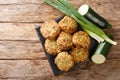 Greek zucchiniÃÂ and feta fritters Summer Light Snack close-up on a slate board. Horizontal top view Royalty Free Stock Photo